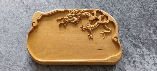 Food serving tray from carved wood